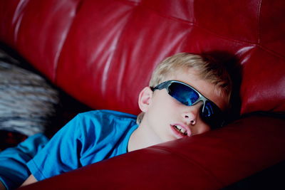 Boy relaxing on couch at home
