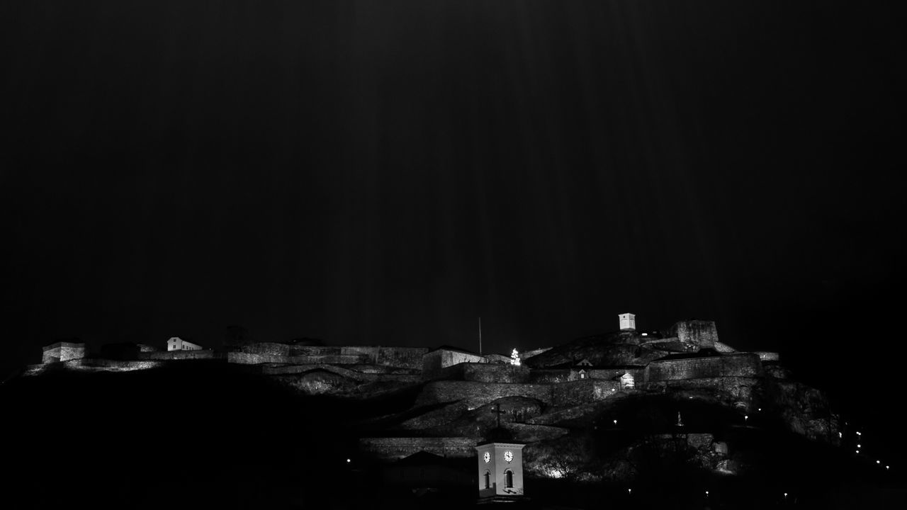 ILLUMINATED BUILDING AGAINST SKY AT NIGHT