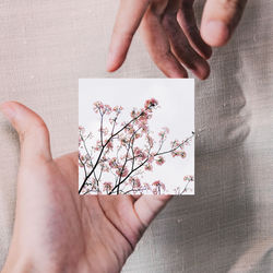 Midsection of woman holding paper