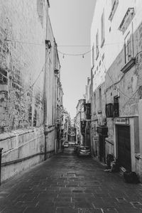 Narrow alley amidst buildings in city