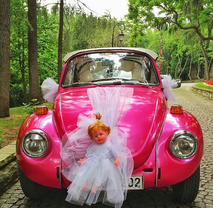 land vehicle, car, transportation, mode of transport, red, tree, street, day, outdoors, close-up, glass - material, stationary, sunlight, vintage car, reflection, travel, no people, childhood, drink, plant