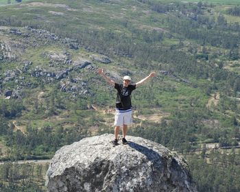 Full length of man standing on rock