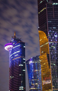 Illuminated buildings in city at night