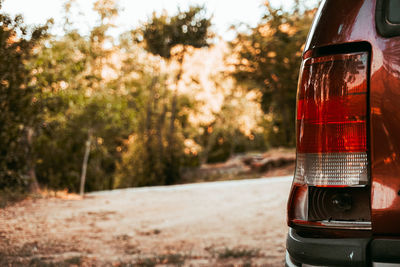 Close-up of red car on road