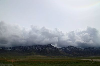 Scenic view of clouds over mountains