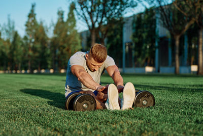 Full length of men on grass in park