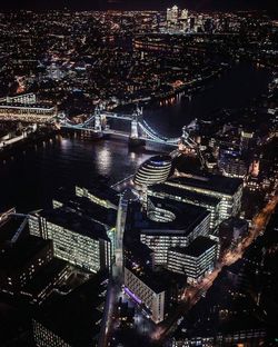 High angle view of city lit up at night