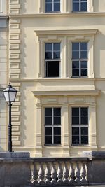 Low angle view of street light against building