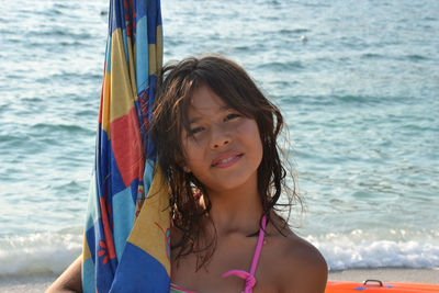 Portrait of smiling woman on beach