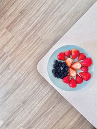 High angle view of strawberries on table