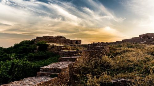 Old ruins against sky during sunset