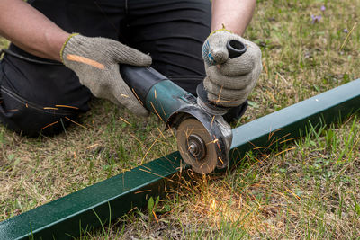 Low section of man working on land