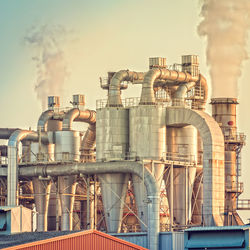 Low angle view of factory against sky