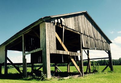 Old wooden structure in field