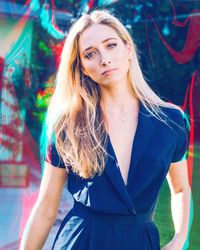 Portrait of beautiful young woman standing outdoors