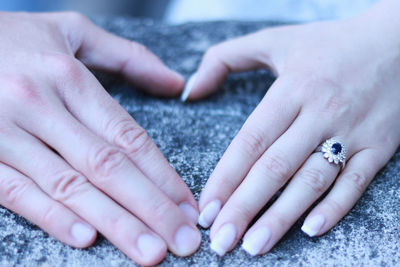 Close-up of hands holding baby hand