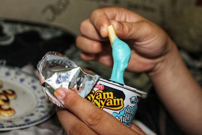 Close-up of hand holding ice cream