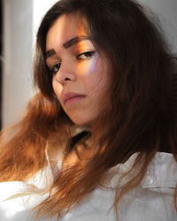 Close-up of young woman at home