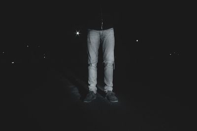 Silhouette of man in dark room