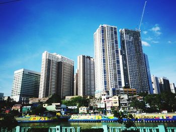 Modern buildings in city against sky