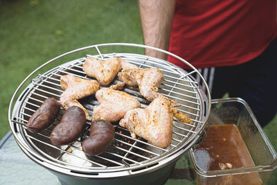 High angle view of meat cooking on barbecue