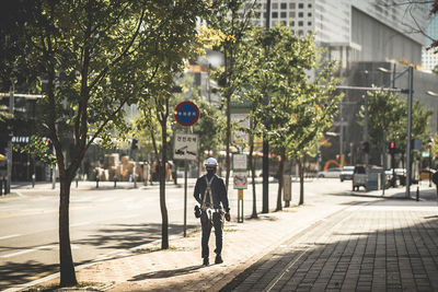 Man cycling on street in city