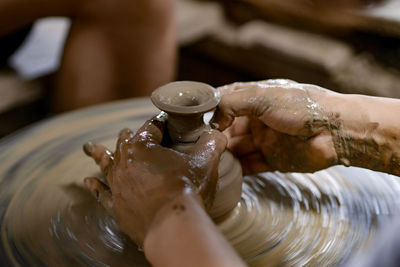 Cropped hand of person washing hands