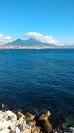 Scenic view of sea against blue sky