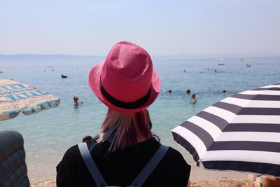 Rear view of woman at beach