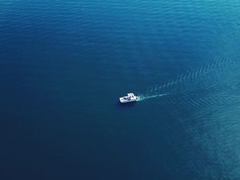 High angle view of ship sailing in sea