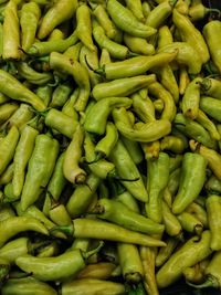 Full frame shot of green chili peppers for sale at market