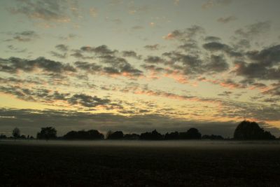 Scenic view of landscape at sunset