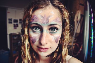 Portrait of young woman with face paint