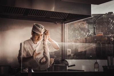 Male chef preparing food in restaurant