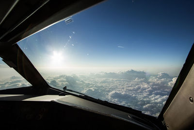 Cropped image of airplane wing over landscape