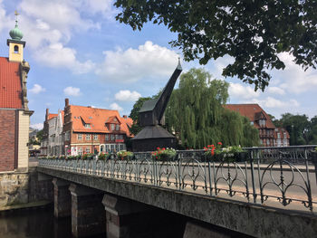 View of bridge in city against sky