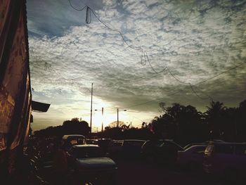 Cars on road against sky