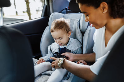 Friends sitting in car