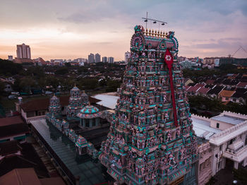 High angle view of buildings in city during sunset