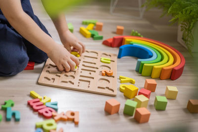 High angle view of man with toy blocks on table