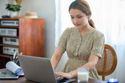 Young woman using mobile phone