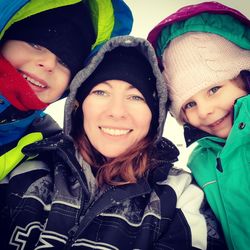 Portrait of happy boy and woman in winter