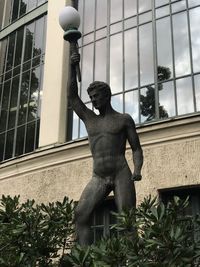 Low angle view of statue against building