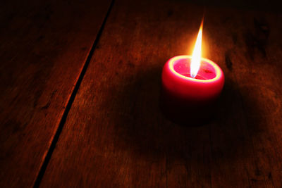 Close-up of illuminated lamp on table