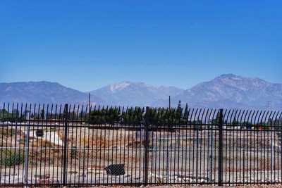 Scenic view of mountains against clear blue sky