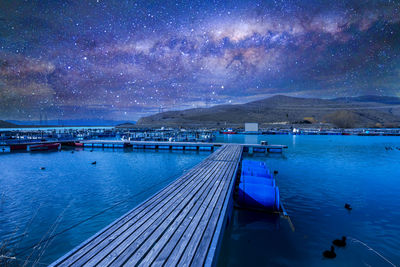 Scenic view of sea against sky at night