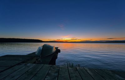 Pier on sea at sunset