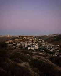 High angle view of buildings against clear sky