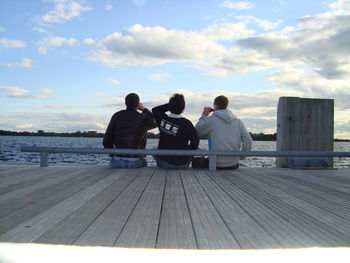 People sitting on pier