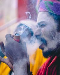 Close-up of man smoking cigarette